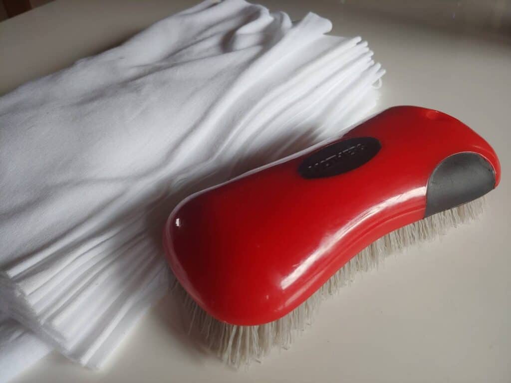 A high quality carpet and upholstery brush will make dislodging loose debris a breeze. Photo Credit: Micah Wright