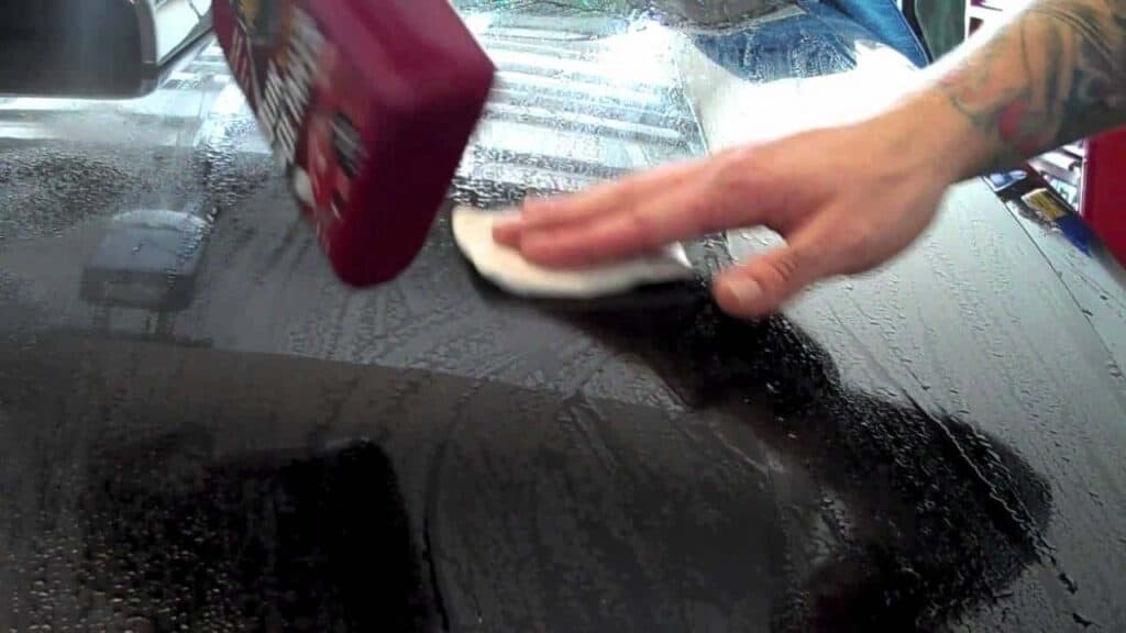 You should remove all the debris with a clay bar after washing you car in DIY complete car paint restoration