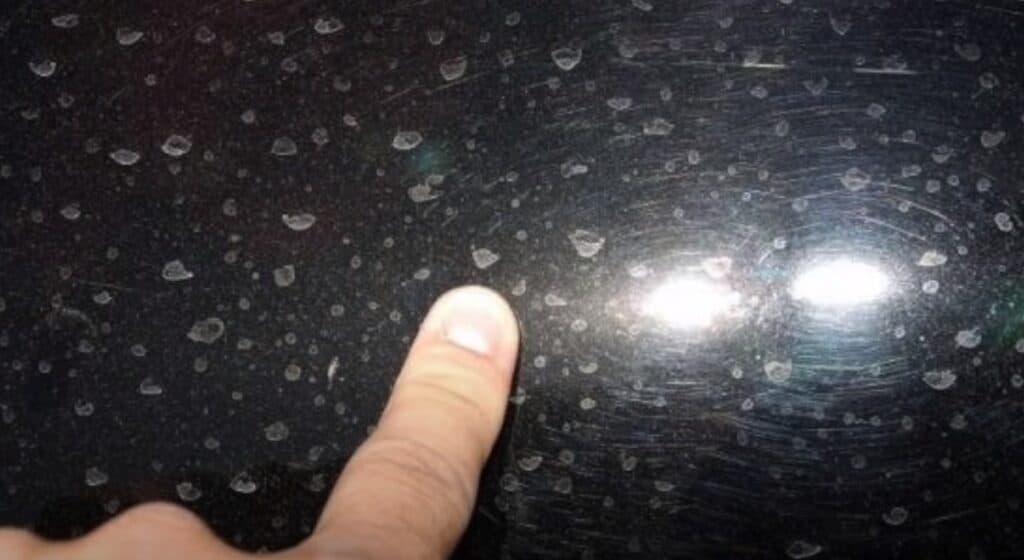 Stage III water spots are the most severe form of water stain, for they have become so deeply engrained in the clear coat, that a series of paint correction procedures must be implemented to remove them. Photo Credit: Pan The Organizer/YouTube