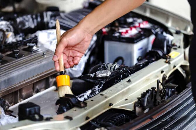 Super cleaning a car's engine bay typically involves steam, chemical degreasers, specialized scrubbing tools like a horse hair brush, and lots of wipe-downs with microfiber towels.