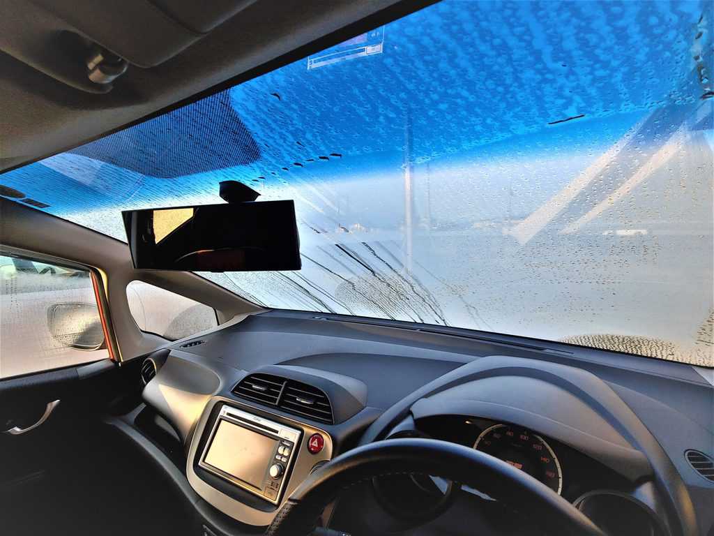 An oily, dirty windshield is not only an eyesore, but a potential visibility risk as well. Photo Credit: Micah Wright